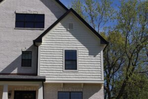 light tan siding made of vinyl shake