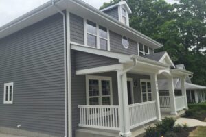 home with beautiful gray vinyl shake siding